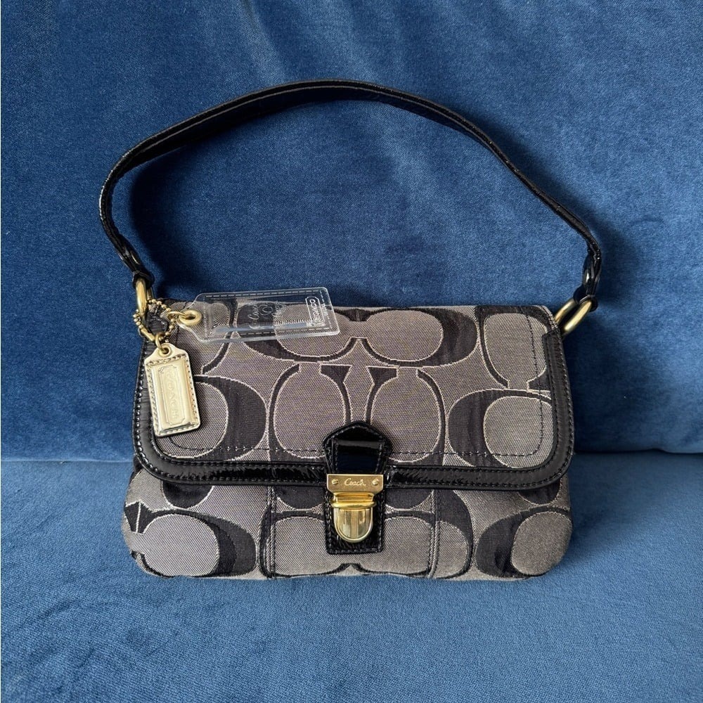 Coach
Coach Black/Grey Signature Canvas and
Patent Leather Shoulder Bag